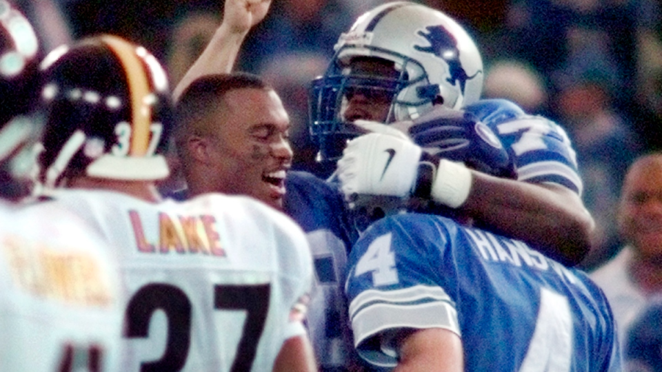 In this Nov. 25, 1993 file photo, The Dallas Cowboys and Miami Dolphins  meet on the icy field of Texas Stadium for an NFL football game on  Thanksgiving Day in Irving, Texas.